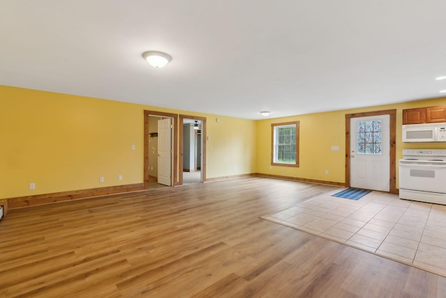 20 Motorcycle Dr, Windham, ME 04062 - unfurnished living room with light wood-type flooring and baseboards