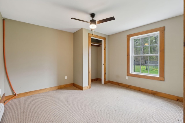 20 Motorcycle Dr, Windham, ME 04062 - unfurnished bedroom with baseboards, carpet, a closet, and ceiling fan