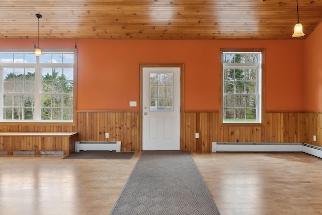 20 Motorcycle Dr, Windham, ME 04062 - entryway featuring a wainscoted wall, a baseboard radiator, wooden walls, wood finished floors, and wooden ceiling