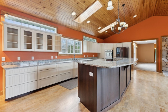 20 Motorcycle Dr, Windham, ME 04062 - kitchen with stainless steel fridge with ice dispenser, a sink, a skylight, wooden ceiling, and glass insert cabinets