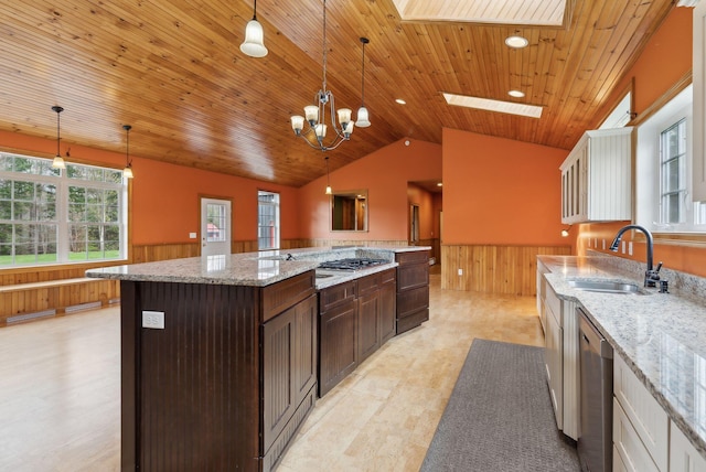 20 Motorcycle Dr, Windham, ME 04062 - kitchen with a sink, wainscoting, wooden walls, dark brown cabinetry, and vaulted ceiling