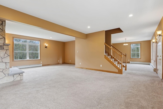 20 Motorcycle Dr, Windham, ME 04062 - unfurnished living room with a baseboard radiator, carpet floors, stairway, baseboards, and a chandelier