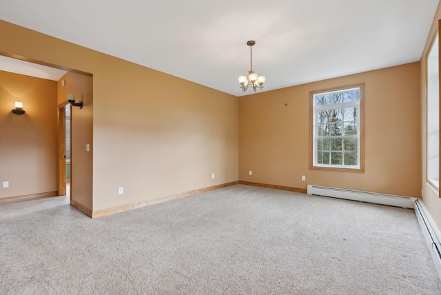 20 Motorcycle Dr, Windham, ME 04062 - empty room with baseboard heating, light carpet, a chandelier, and baseboards