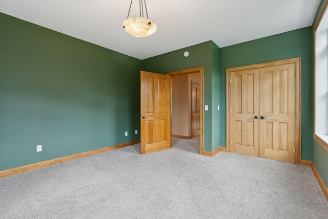 20 Motorcycle Dr, Windham, ME 04062 - unfurnished bedroom with carpet floors, baseboards, and a closet