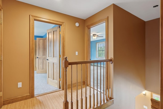 20 Motorcycle Dr, Windham, ME 04062 - hall with wood finished floors, an upstairs landing, and a baseboard radiator