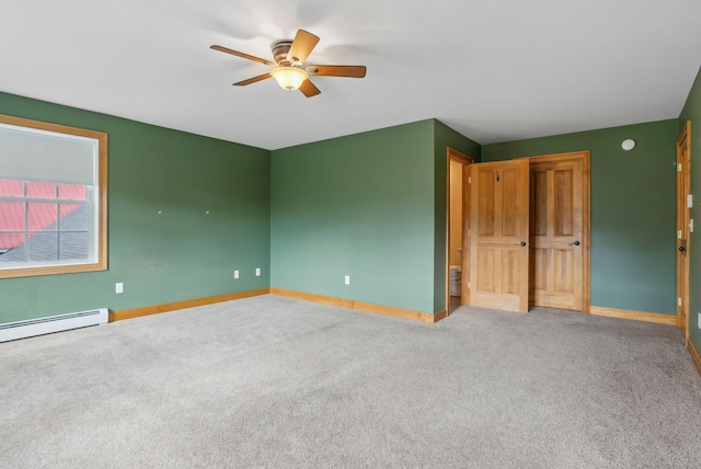 20 Motorcycle Dr, Windham, ME 04062 - unfurnished bedroom with a baseboard heating unit, carpet, baseboards, and a ceiling fan