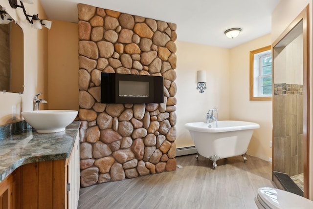 20 Motorcycle Dr, Windham, ME 04062 - full bath with wood finished floors, baseboard heating, a soaking tub, and vanity