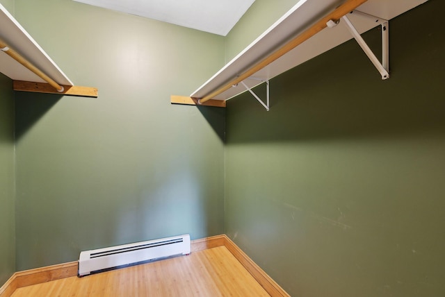 20 Motorcycle Dr, Windham, ME 04062 - spacious closet with a baseboard radiator and wood finished floors