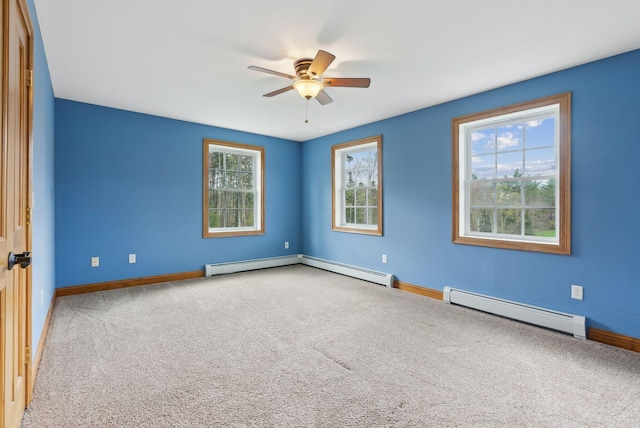 20 Motorcycle Dr, Windham, ME 04062 - spare room featuring baseboard heating, ceiling fan, plenty of natural light, and carpet
