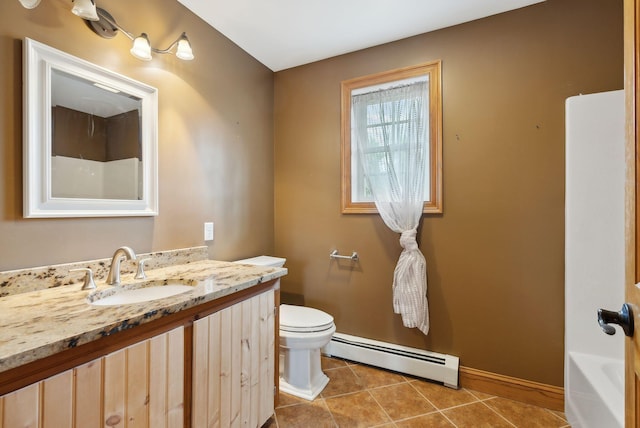 20 Motorcycle Dr, Windham, ME 04062 - full bath with a baseboard heating unit, baseboards, toilet, vanity, and tile patterned flooring