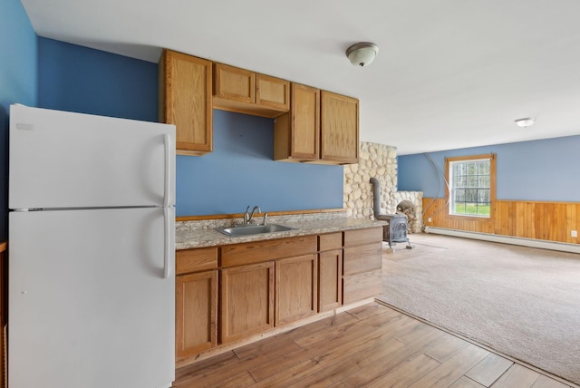 20 Motorcycle Dr, Windham, ME 04062 - kitchen featuring freestanding refrigerator, a sink, light countertops, a wainscoted wall, and light wood-style floors