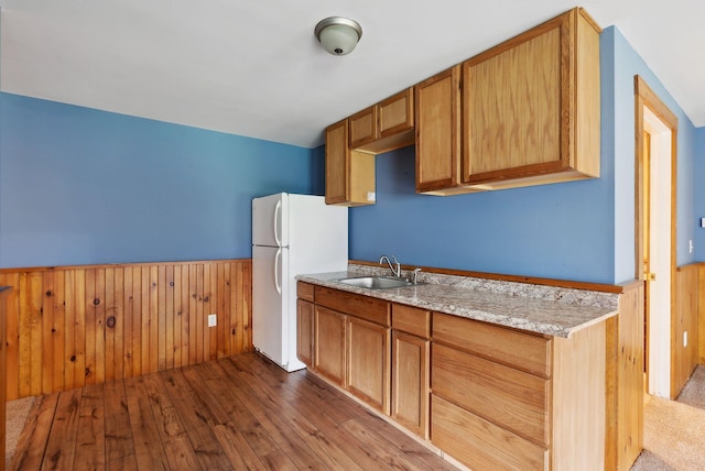 20 Motorcycle Dr, Windham, ME 04062 - kitchen featuring a wainscoted wall, freestanding refrigerator, hardwood / wood-style flooring, a sink, and wood walls