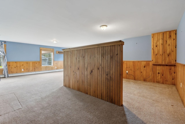 20 Motorcycle Dr, Windham, ME 04062 - carpeted empty room featuring baseboard heating, wooden walls, and a wainscoted wall