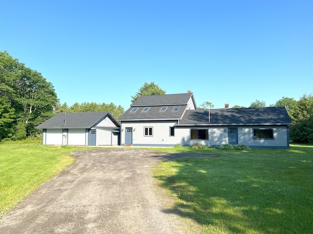 320 Spring Rd, Augusta, ME 04330 - view of front of house with a garage, an outbuilding, a front yard, driveway, and a chimney