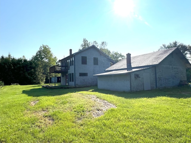 320 Spring Rd, Augusta, ME 04330 - back of house featuring a chimney, a yard, and a wooden deck