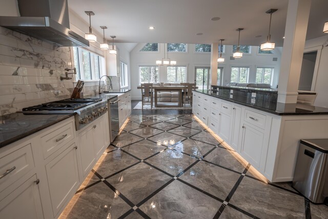 106 Webb River Dr, Dixfield, ME 04224 - kitchen with exhaust hood, stainless steel appliances, marble tiled floors, decorative backsplash, and white cabinets