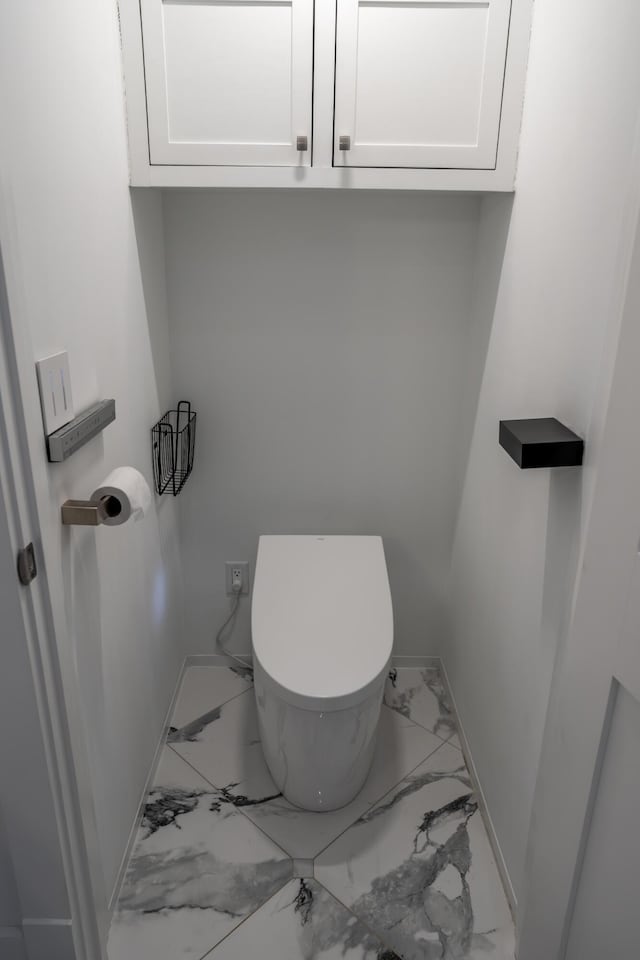106 Webb River Dr, Dixfield, ME 04224 - bathroom with marble finish floors, toilet, and baseboards