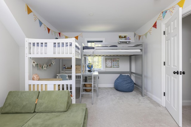 bedroom with carpet floors and baseboards