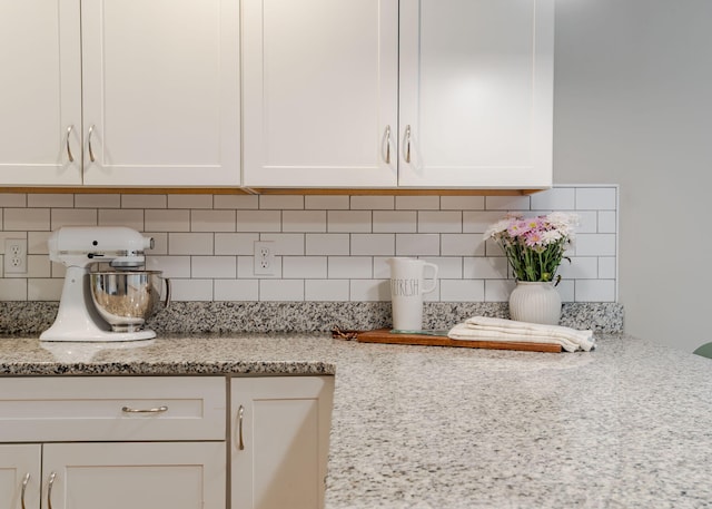 22 Lilac Ln, Gorham, ME 04038 - kitchen view of white cabinets, tasteful backsplash, and light stone counters