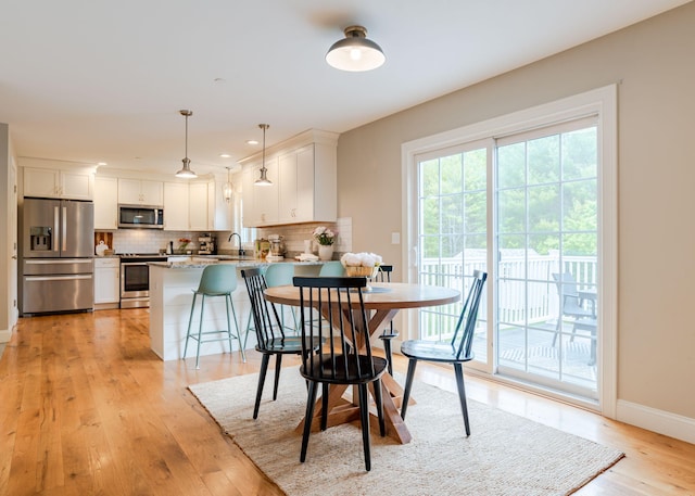 22 Lilac Ln, Gorham, ME 04038 - dining space featuring light wood-type flooring, baseboards, and recessed lighting