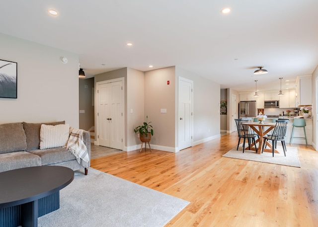 22 Lilac Ln, Gorham, ME 04038 - living area featuring light wood finished floors, recessed lighting, and baseboards