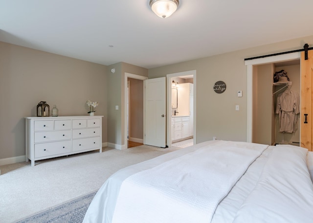 22 Lilac Ln, Gorham, ME 04038 - bedroom featuring a barn door, baseboards, light carpet, and ensuite bathroom