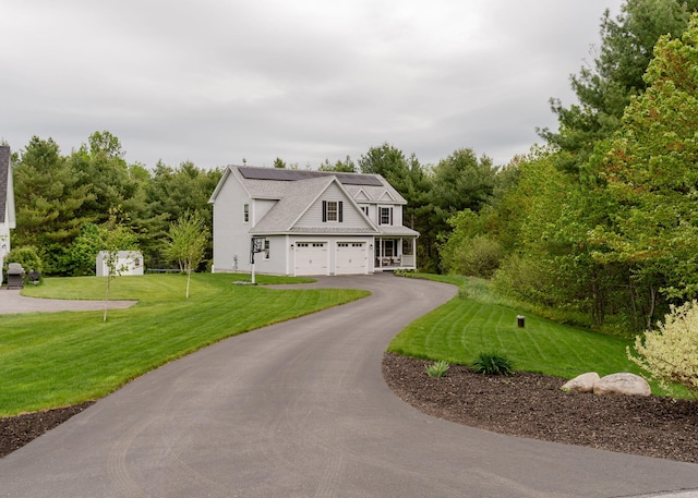 22 Lilac Ln, Gorham, ME 04038 - view of front of property featuring asphalt driveway, a front lawn, and roof mounted solar panels