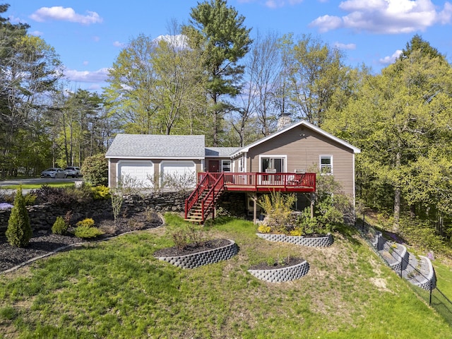 591 Eight Rod Rd, Augusta, ME 04330 - rear view of house with a deck, a lawn, a chimney, a garage, and stairway