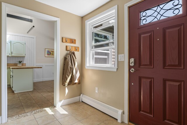 591 Eight Rod Rd, Augusta, ME 04330 - entryway featuring baseboard heating, light tile patterned floors, and baseboards