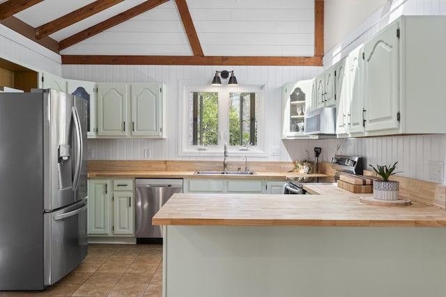 591 Eight Rod Rd, Augusta, ME 04330 - kitchen with appliances with stainless steel finishes, a sink, wooden counters, light tile patterned floors, and a peninsula