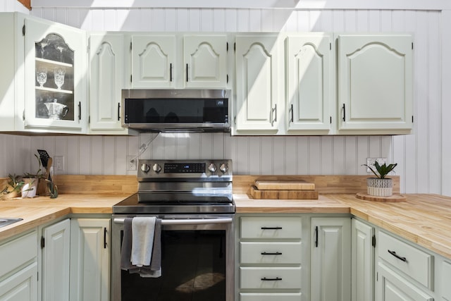 591 Eight Rod Rd, Augusta, ME 04330 - kitchen featuring stainless steel appliances, wood counters, glass insert cabinets, and white cabinets