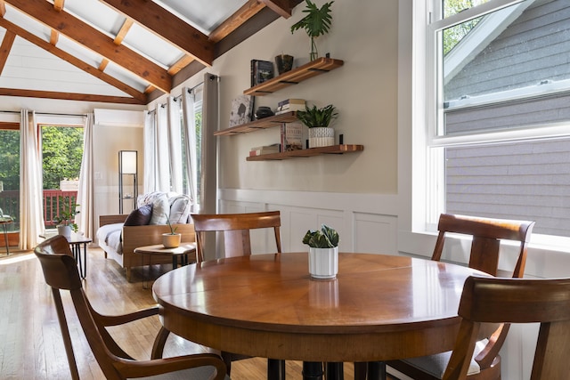 591 Eight Rod Rd, Augusta, ME 04330 - dining space featuring hardwood / wood-style flooring, wainscoting, a decorative wall, and a skylight