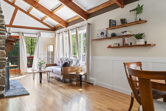 591 Eight Rod Rd, Augusta, ME 04330 - living area featuring plenty of natural light, light wood-type flooring, a decorative wall, a wall mounted air conditioner, and wainscoting