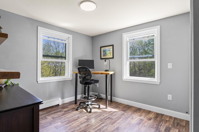 591 Eight Rod Rd, Augusta, ME 04330 - office area featuring a baseboard radiator, wood finished floors, and baseboards