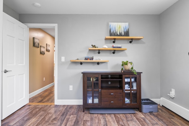 591 Eight Rod Rd, Augusta, ME 04330 - bar area featuring baseboard heating, wood finished floors, and baseboards