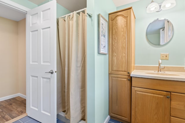 591 Eight Rod Rd, Augusta, ME 04330 - bathroom with vanity, a shower with shower curtain, and baseboards