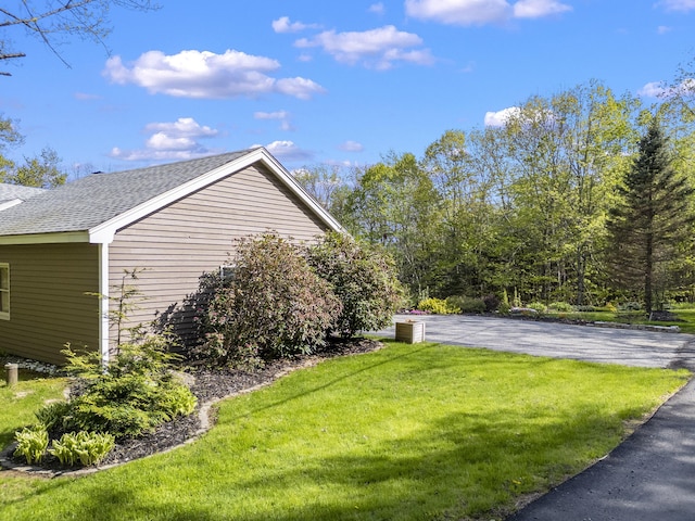 591 Eight Rod Rd, Augusta, ME 04330 - view of home's exterior with roof with shingles and a lawn