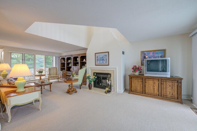 5 Goodridge Dr Unit 5, Naples, ME 04055 - carpeted living room featuring a glass covered fireplace