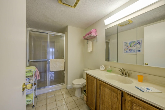 5 Goodridge Dr Unit 5, Naples, ME 04055 - full bathroom featuring a shower stall, tile patterned floors, toilet, vanity, and a textured ceiling