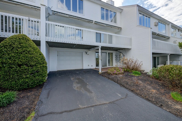 5 Goodridge Dr Unit 5, Naples, ME 04055 - view of property with a garage and asphalt driveway