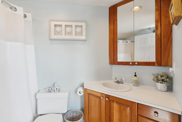 15 Christensen Ln Unit A1, Kennebunk, ME 04043 - bathroom with vanity, toilet, and a shower with curtain