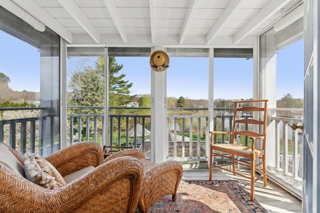15 Christensen Ln Unit A1, Kennebunk, ME 04043 - sunroom / solarium with beamed ceiling, expansive windows, and wood finished floors