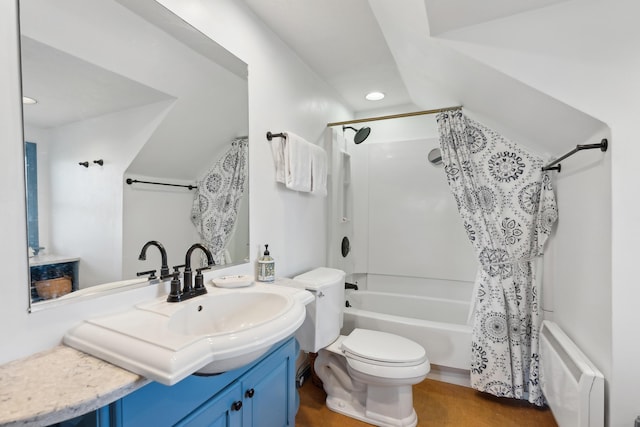15 Christensen Ln Unit A1, Kennebunk, ME 04043 - bathroom featuring shower / bath combo, recessed lighting, toilet, radiator heating unit, and vanity