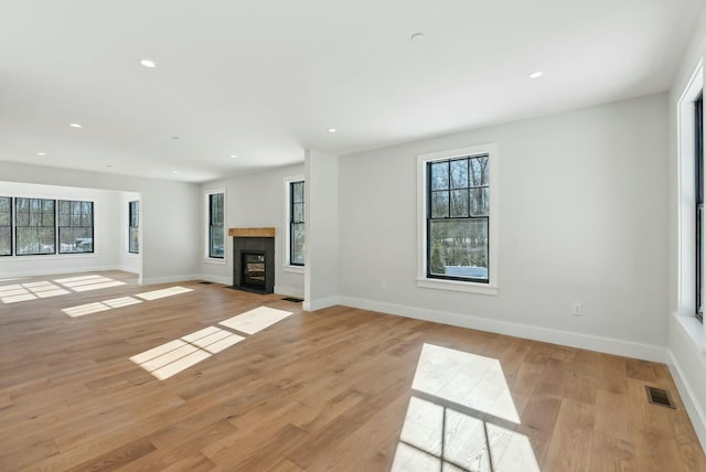 11 Acorn Ave, Kennebunkport, ME 04046 - unfurnished living room with healthy amount of natural light, recessed lighting, baseboards, and light wood-type flooring