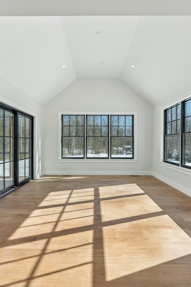 11 Acorn Ave, Kennebunkport, ME 04046 - unfurnished living room featuring wood finished floors, vaulted ceiling, and baseboards