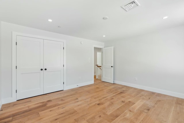 11 Acorn Ave, Kennebunkport, ME 04046 - unfurnished bedroom with light wood finished floors, baseboards, recessed lighting, and a closet