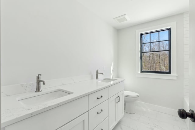 11 Acorn Ave, Kennebunkport, ME 04046 - bathroom with marble finish flooring, toilet, double vanity, and baseboards