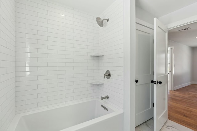 11 Acorn Ave, Kennebunkport, ME 04046 - full bathroom featuring baseboards, bathtub / shower combination, and marble look tiles
