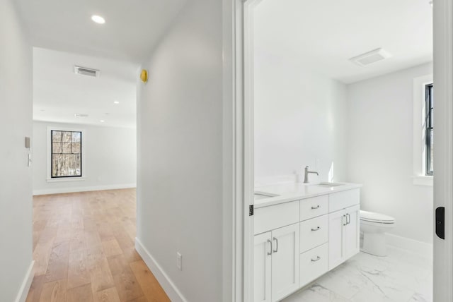 11 Acorn Ave, Kennebunkport, ME 04046 - hall featuring a sink, baseboards, and recessed lighting