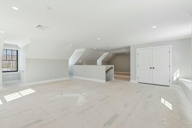 11 Acorn Ave, Kennebunkport, ME 04046 - additional living space with vaulted ceiling, baseboards, and recessed lighting